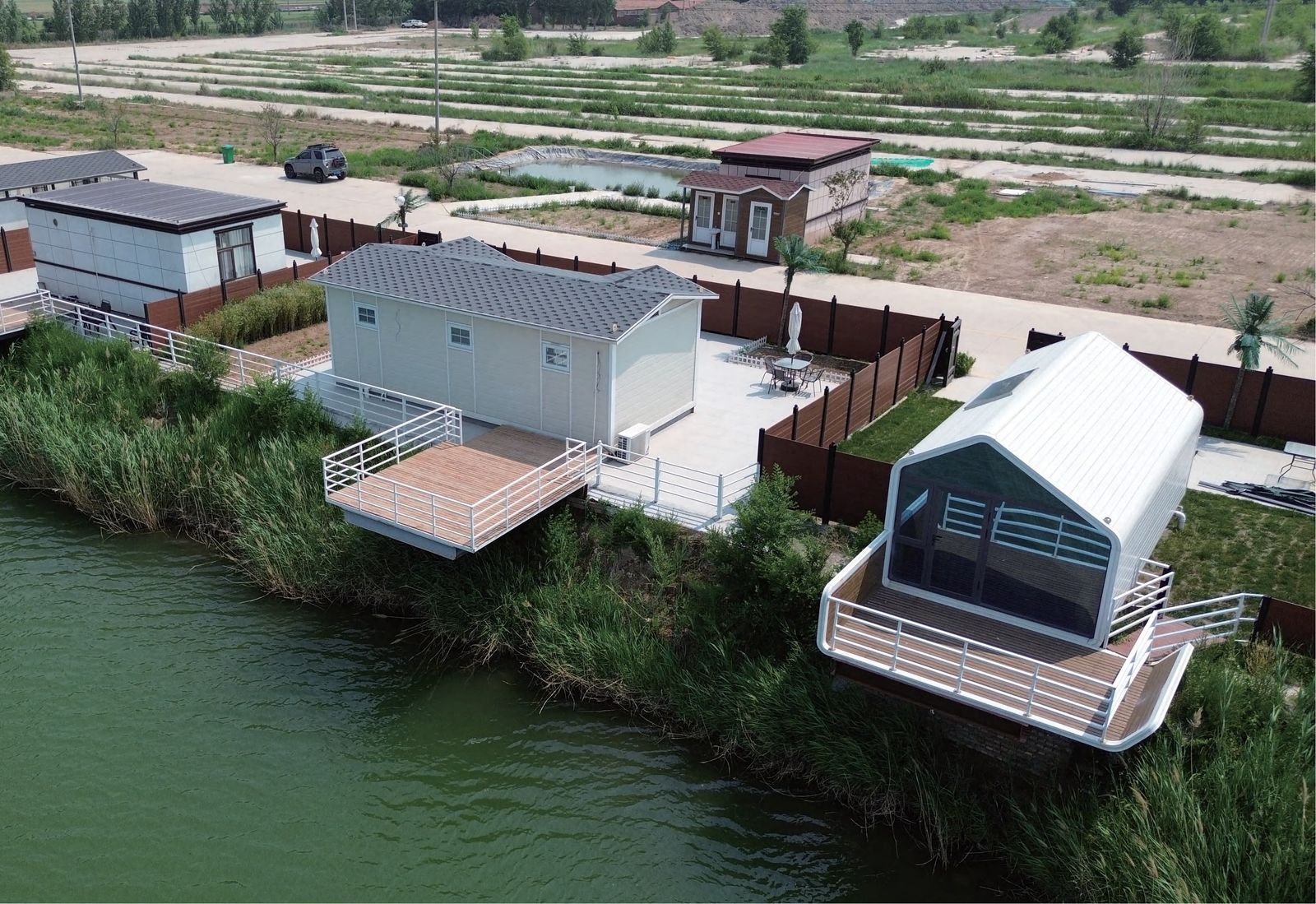 Lakeside prefab cabin development with wooden decks