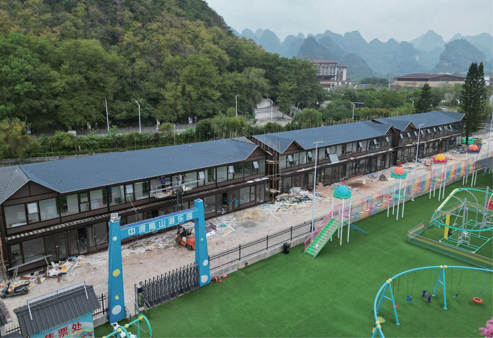 Prefabricated site camp buildings under construction at tourism project