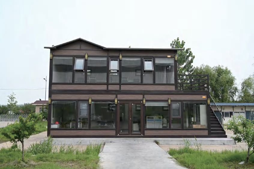 Two-story modular building with wood-textured siding
